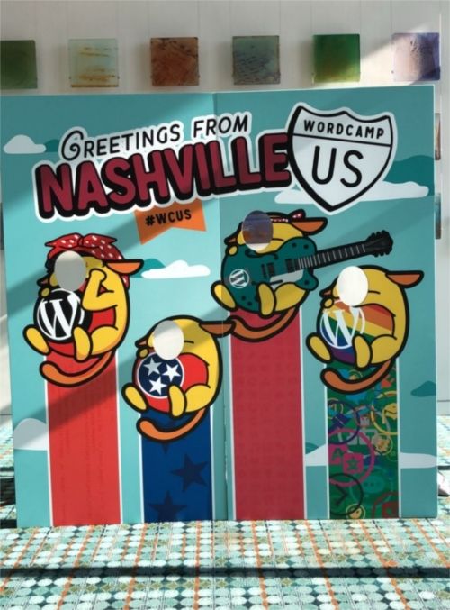 A board with face holes featuring the Wapuus of WordPress - Caption reads &quot;Greetings from Nashville #WCUS&quot;