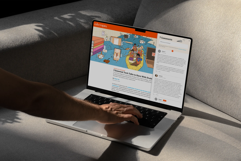 A person using a laptop on a grey couch, viewing an Edutopia article titled “5 Essential Tech Talks to Have With Students.” The screen shows a colourful illustration of students in a raft navigating through a sea of technology icons, and a sidebar with user comments is visible on the right.