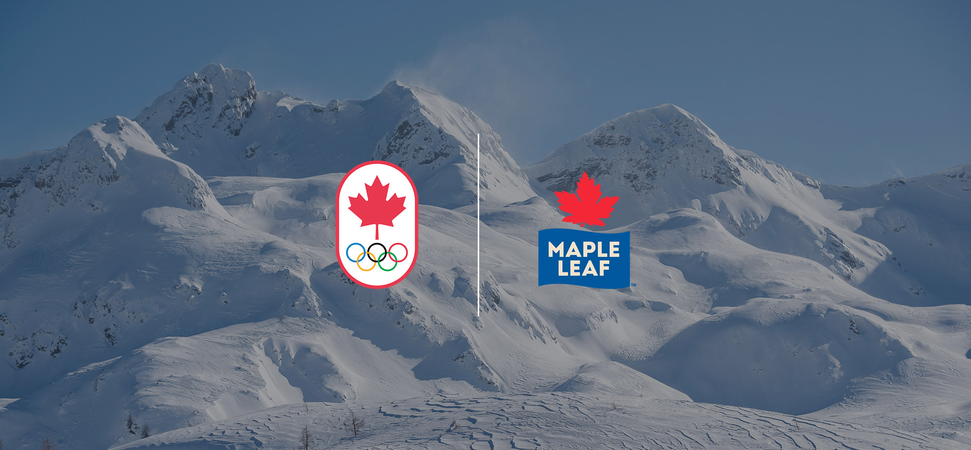 The Canadian Olympic Committee logo and the Maple Leaf Foods logo appear side by side over a backdrop of snow-covered mountains under a clear blue sky.