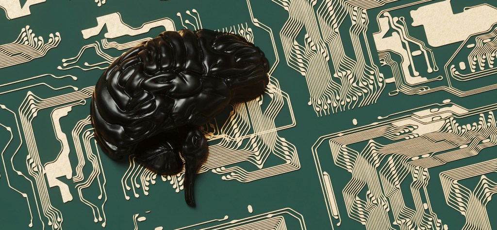 A glossy black sculpted brain rests on a green circuit board patterned with intricate gold pathways, blending organic and digital elements.