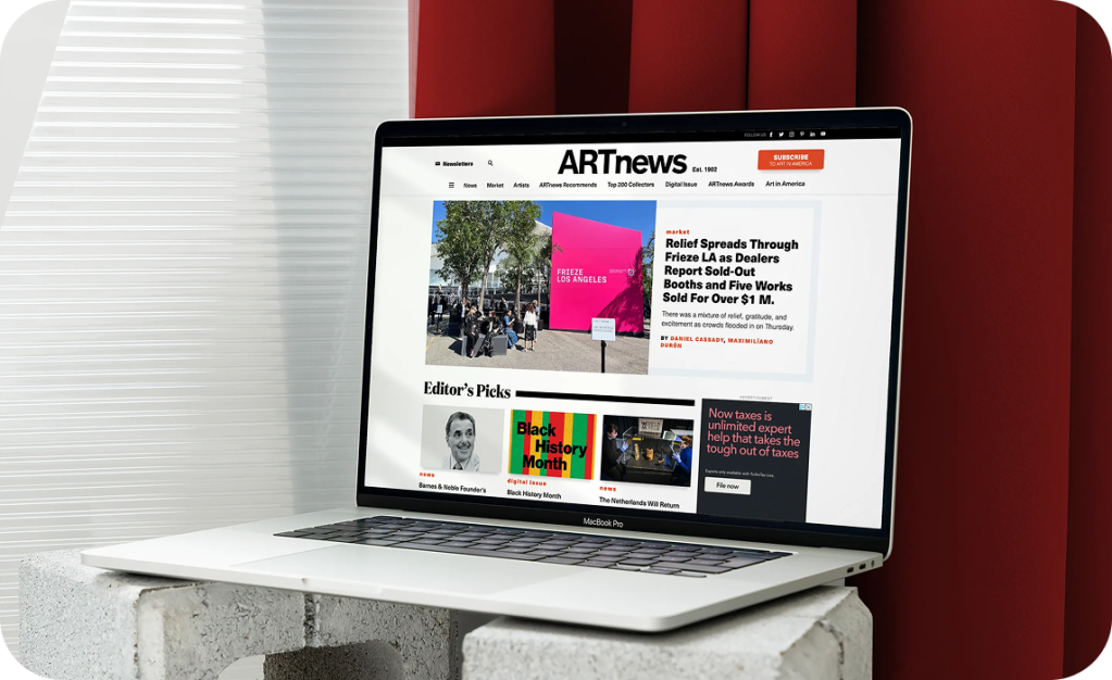 Artnews homepage shown on a laptop 