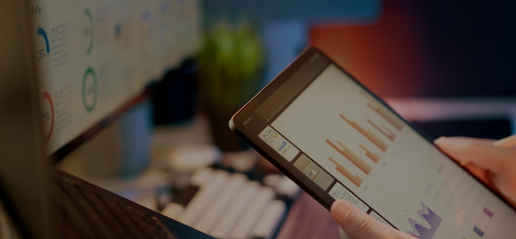 Close-up of tablet displaying performance analytics dashboards with charts and graphs, representing monitoring, system health analysis, and performance evaluation in digital platforms.