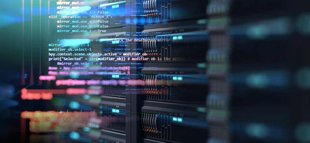 Close-up of enterprise server infrastructure with colorful programming code overlaid on the image, representing cloud computing, hosting infrastructure, and software operations.