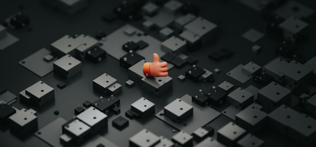 Single thumbs-up icon emerging from a field of dark geometric blocks, symbolizing validation, approval, confidence, or successful AI adoption.