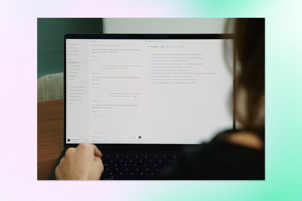 Person using Cursor Projects on a laptop, with project tasks and AI-generated responses visible on screen.