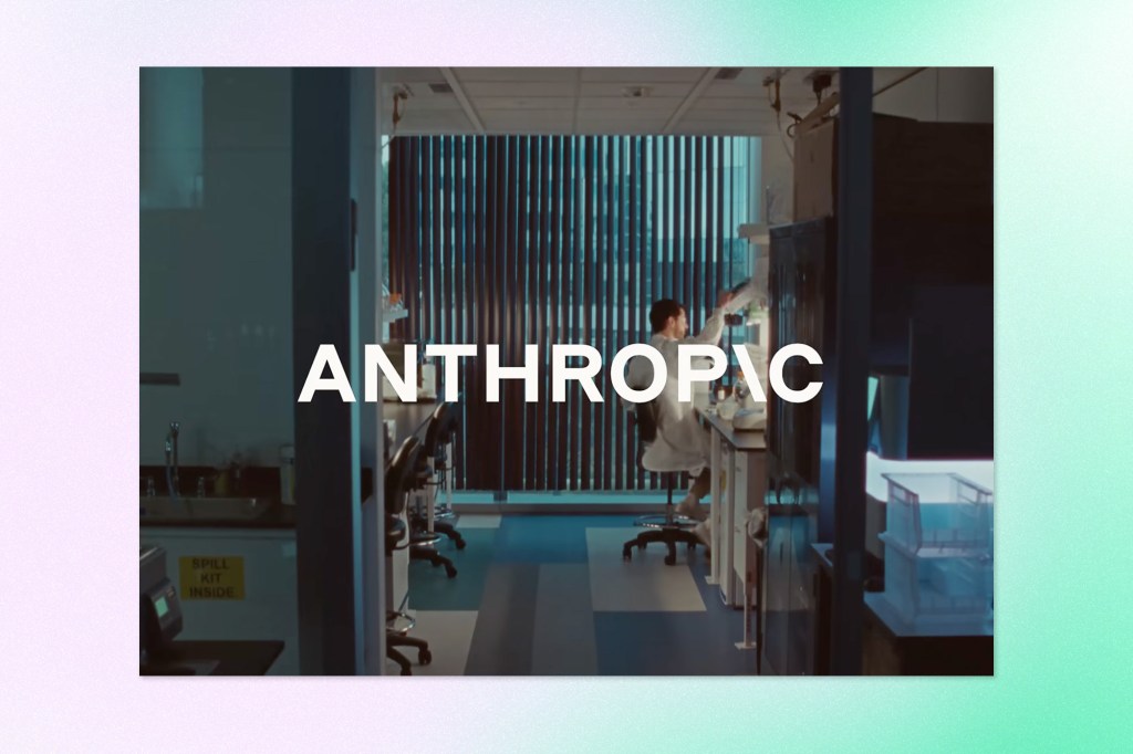 Anthropic branding over a laboratory scene with a researcher working in the background.