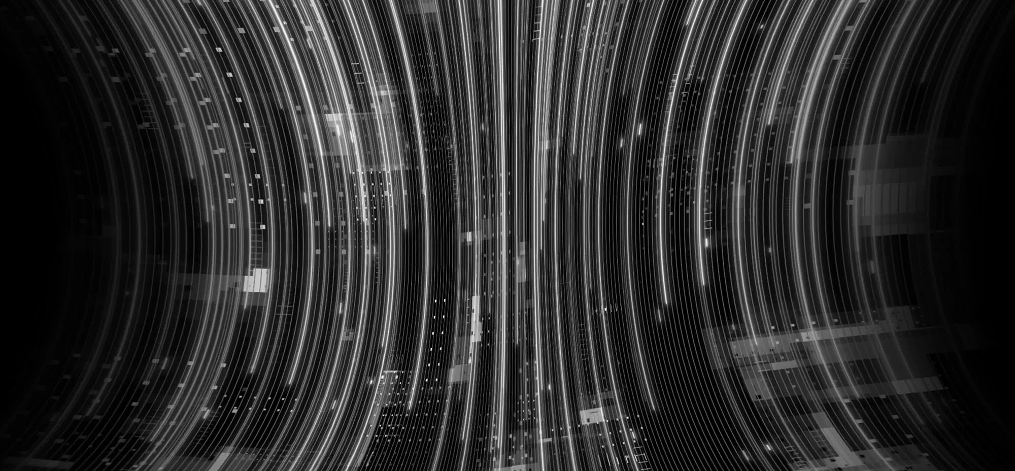 Abstract digital illustration of multicoloured light trails and data streams flowing across a dark background, representing artificial intelligence and technological innovation.